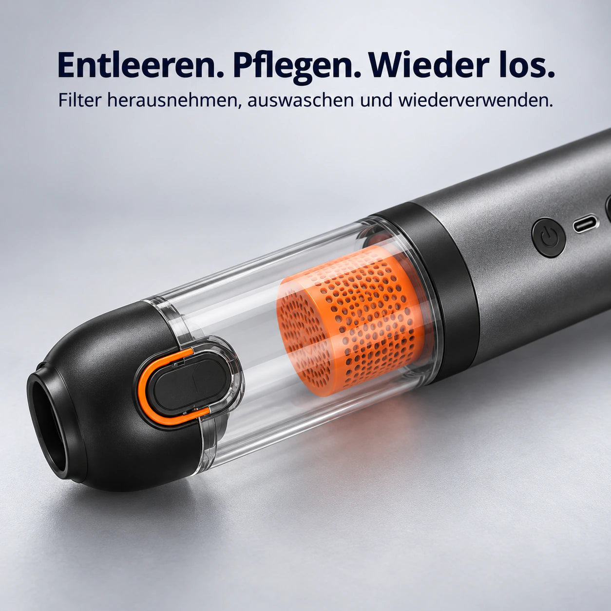 Nahaufnahme des AIR-FUSION Staubbehälters mit orangefarbenem Filter und Entriegelung