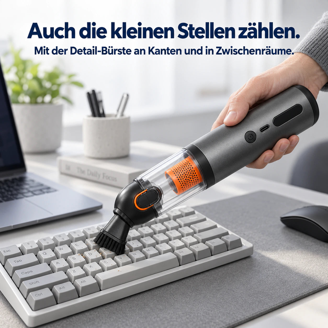 AIR-FUSION mit kurzer Detail-Bürste bei der Reinigung einer Tastatur